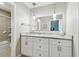 Bathroom vanity with modern fixtures, granite countertops, pendant lighting, and large mirrors at 701 Poinsettia Rd # 322, Belleair, FL 33756