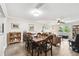 Spacious dining room flowing into the living area with a hardwood floor at 701 Poinsettia Rd # 322, Belleair, FL 33756