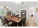 Comfortable dining room featuring a large wooden table and a view of the living room at 701 Poinsettia Rd # 322, Belleair, FL 33756