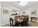 Cozy dining room leading to updated kitchen with stainless appliances and stone countertops at 701 Poinsettia Rd # 322, Belleair, FL 33756