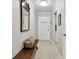 Entryway featuring a wooden bench, tile floor, and view of another room at 701 Poinsettia Rd # 322, Belleair, FL 33756