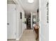View of the entryway with tile floor, bench, and view of living room at 701 Poinsettia Rd # 322, Belleair, FL 33756