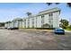 Exterior view of the community with a large parking area at 701 Poinsettia Rd # 322, Belleair, FL 33756