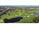 Scenic aerial view of the lush golf course with mature trees and serene blue ponds at 701 Poinsettia Rd # 322, Belleair, FL 33756