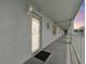 View of the hallway leading to condo units, featuring a secure entrance at 701 Poinsettia Rd # 322, Belleair, FL 33756