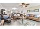 Open-concept living room featuring hardwood floors and comfortable seating area at 701 Poinsettia Rd # 322, Belleair, FL 33756