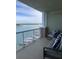 Enjoy the stunning water views from this condo's spacious balcony with comfortable seating and waterfront views at 706 Bayway Blvd # 502, Clearwater Beach, FL 33767