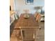 Dining area with a wood table, seating for six, and modern decor at 706 Bayway Blvd # 502, Clearwater Beach, FL 33767