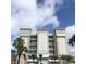 A modern, multi-story building with a clean, architectural design and serene color palette at 706 Bayway Blvd # 502, Clearwater Beach, FL 33767