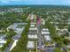 Scenic aerial shot of a condominium complex with mature trees and manicured landscaping at 720 Lyndhurst St # 1101, Dunedin, FL 34698