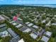 Expansive aerial view of the condominium complex surrounded by mature trees and lush landscaping at 720 Lyndhurst St # 1101, Dunedin, FL 34698