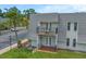 Exterior view showcasing a balcony and nearby parking at 720 Lyndhurst St # 1101, Dunedin, FL 34698