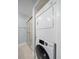 Bathroom features a stand up shower and a stackable washer and dryer at 720 Lyndhurst St # 1101, Dunedin, FL 34698