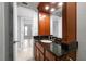 Bathroom vanity with granite countertop and wood cabinet at 720 Lyndhurst St # 1101, Dunedin, FL 34698