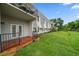 Charming building featuring outdoor patio and balcony, surrounded by lush landscaping at 720 Lyndhurst St # 1101, Dunedin, FL 34698
