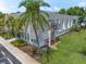 Aerial view showing the building's architecture, landscaping, and surrounding area at 720 Lyndhurst St # 1101, Dunedin, FL 34698