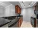 Kitchen featuring granite countertops, track lighting, and stainless steel appliances at 720 Lyndhurst St # 1101, Dunedin, FL 34698