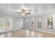 Bright and spacious living room featuring tile floors, neutral walls, and patio access at 720 Lyndhurst St # 1101, Dunedin, FL 34698