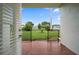 Cozy outdoor patio offering a private outdoor space with a lawn view at 720 Lyndhurst St # 1101, Dunedin, FL 34698