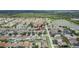 Aerial view of neighborhood including the property and a nearby pond at 7603 Wood Violet Dr, Gibsonton, FL 33534