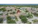 Aerial view of the home in a mature neighborhood with a nearby lake at 7603 Wood Violet Dr, Gibsonton, FL 33534