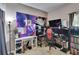 A bedroom is shown with gaming decor and a computer setup with desk at 7603 Wood Violet Dr, Gibsonton, FL 33534