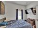 Bedroom with soft carpeting, natural light from the window, and a ceiling fan at 7603 Wood Violet Dr, Gibsonton, FL 33534