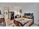 Bedroom with natural lighting, with a small fridge and desk setup at 7603 Wood Violet Dr, Gibsonton, FL 33534