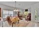 Bright dining area open to the living room, perfect for entertaining with lots of natural light at 7603 Wood Violet Dr, Gibsonton, FL 33534