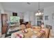 Open-concept dining and living area with ample natural light and a cozy atmosphere at 7603 Wood Violet Dr, Gibsonton, FL 33534