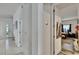 Bright hallway leading to various rooms, showcasing tile flooring and fresh paint at 7603 Wood Violet Dr, Gibsonton, FL 33534