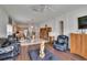 Inviting living room features wood laminate flooring and an open floorplan to the kitchen and dining area at 7603 Wood Violet Dr, Gibsonton, FL 33534