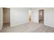 A spacious bedroom features neutral carpeting and trim, and doorways to the closet and bath at 7678 Deer Valley Circle, Tampa, FL 33635