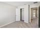 A bedroom featuring neutral carpet and access to a closet and adjoining room at 7678 Deer Valley Circle, Tampa, FL 33635
