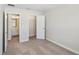A neutrally decorated bedroom with doorways to the bathroom and closet at 7678 Deer Valley Circle, Tampa, FL 33635