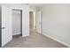 This bedroom has neutral carpet, a large closet, and doors that match the trim at 7678 Deer Valley Circle, Tampa, FL 33635