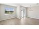 Dining area with sliding glass doors to outside patio with modern chandelier at 7678 Deer Valley Circle, Tampa, FL 33635