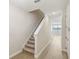 A bright entryway shows stairs, wood-look tile flooring and white doors at 7678 Deer Valley Circle, Tampa, FL 33635