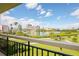 Enjoy breathtaking water views from this balcony, framed by lush greenery and clear skies at 7893 Sailboat Key S Blvd # 304, South Pasadena, FL 33707