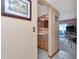 Charming bathroom featuring light-colored cabinets, tiled flooring, and a view leading to the main bedroom at 7893 Sailboat Key S Blvd # 304, South Pasadena, FL 33707