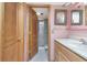 Well-maintained bathroom with a vanity, ample storage, and a separate shower area for convenience at 7893 Sailboat Key S Blvd # 304, South Pasadena, FL 33707