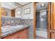 Charming bathroom with a unique vanity and tiled shower, offering a cozy atmosphere at 7893 Sailboat Key S Blvd # 304, South Pasadena, FL 33707
