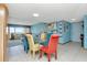 A bright dining area showcases colorful chairs, an airy layout and transitions into the living space with great light at 7893 Sailboat Key S Blvd # 304, South Pasadena, FL 33707