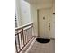 Apartment entryway featuring a secure front door and balcony with views at 7893 Sailboat Key S Blvd # 304, South Pasadena, FL 33707