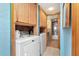 Convenient laundry room featuring washer, dryer, and cabinetry for ample storage options at 7893 Sailboat Key S Blvd # 304, South Pasadena, FL 33707
