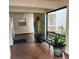 Inviting lobby area with bench seating, lush plants, and brick flooring providing a welcoming atmosphere at 7893 Sailboat Key S Blvd # 304, South Pasadena, FL 33707