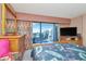 Relaxing main bedroom with private balcony, offering natural light and serene views at 7893 Sailboat Key S Blvd # 304, South Pasadena, FL 33707