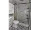 Stylishly designed bathroom with modern fixtures, including a toilet, shower, and vanity at 820 Crenshaw Lake Rd, Lutz, FL 33548