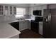 Well-lit kitchen featuring stainless steel appliances, modern countertops, and ample cabinet space at 820 Crenshaw Lake Rd, Lutz, FL 33548