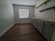 Bright office featuring stylish wood floors, ample storage, and a neutral color palette at 820 Crenshaw Lake Rd, Lutz, FL 33548